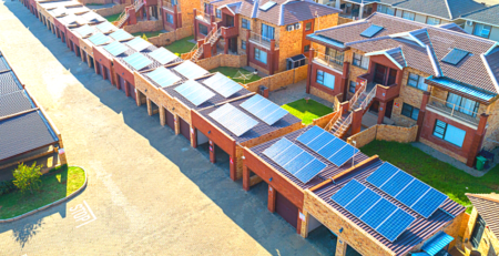 A sectional title scheme with solar panels on rooftops